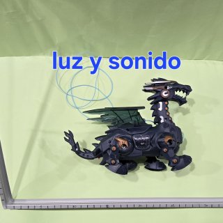 Dinosaurio con bolsa a pila con luz y sonido